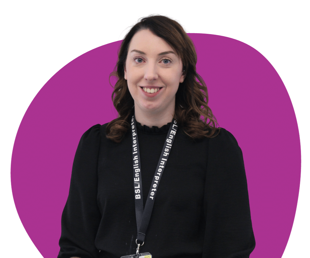 White woman with long, brown, curly hair against a purple background.