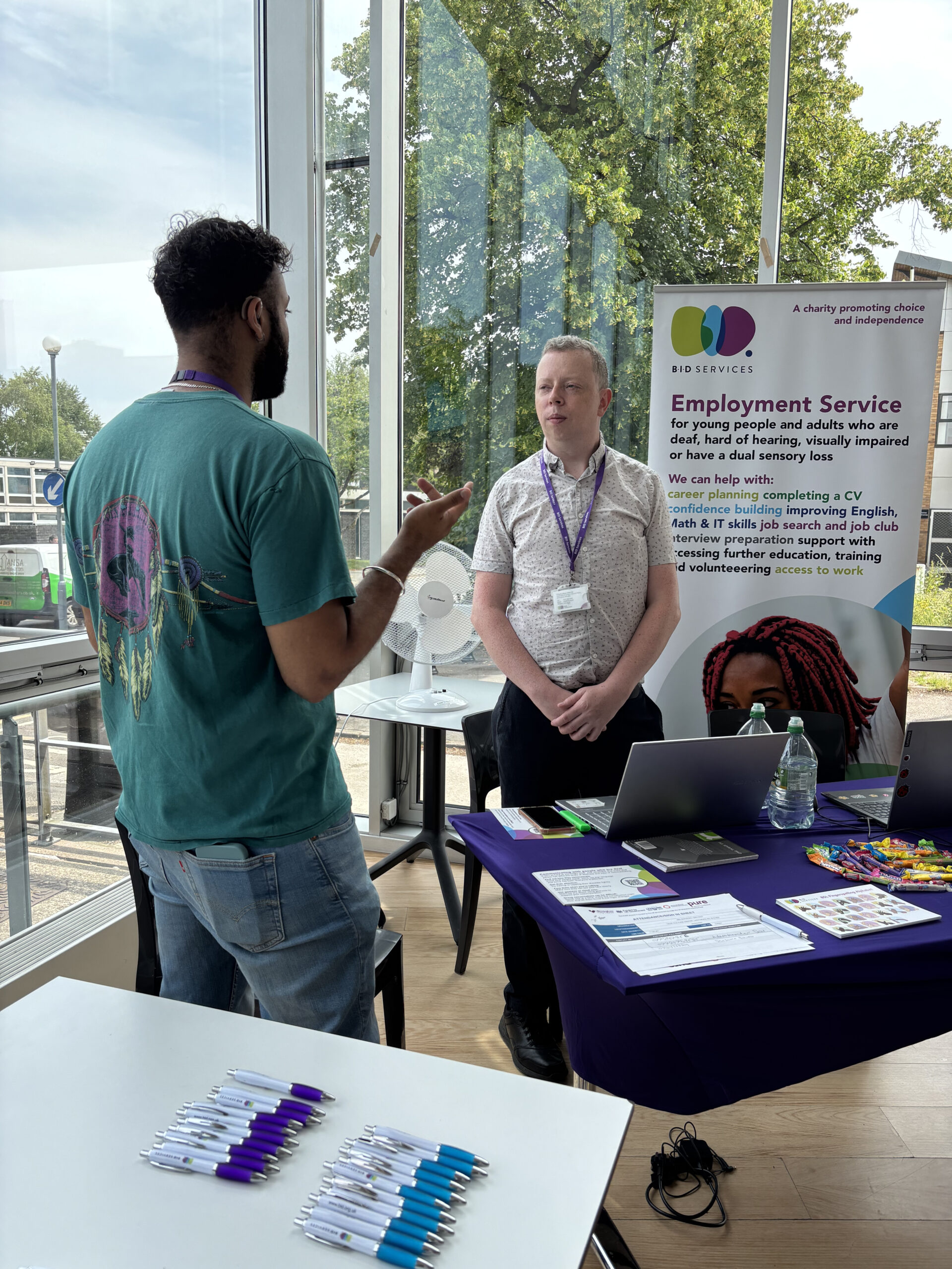 Male staff member from our employment team having a conversation in BSL.